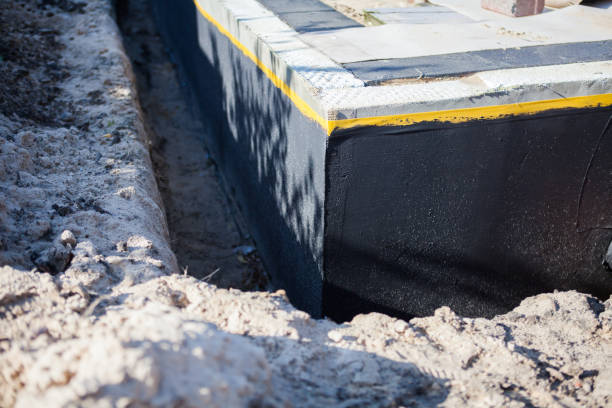 Professional Waterproofing technician working in Roundhead, OH
